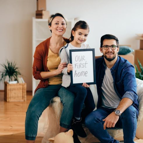 portrait-happy-family-their-new-home-min